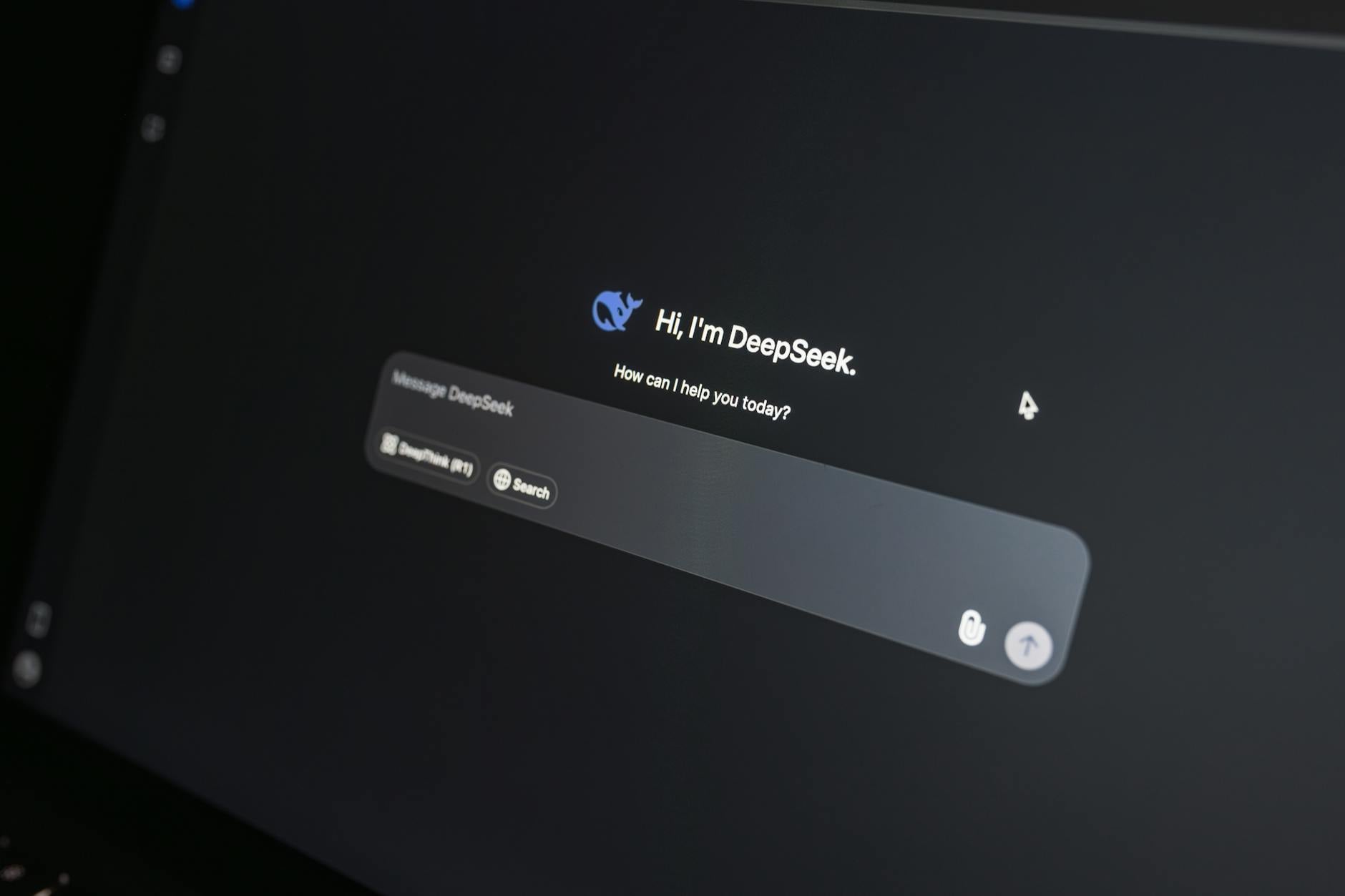 DeepSeek AI chat interface showing conversational AI tool on laptop, relevant to Google's 2026 AI content safety guidelines