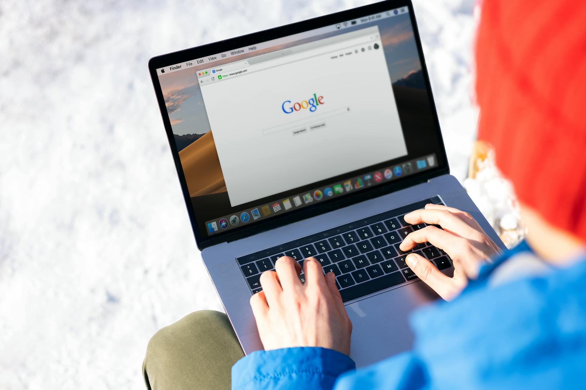 Small business owner optimising local SEO on laptop in Australian outdoor setting