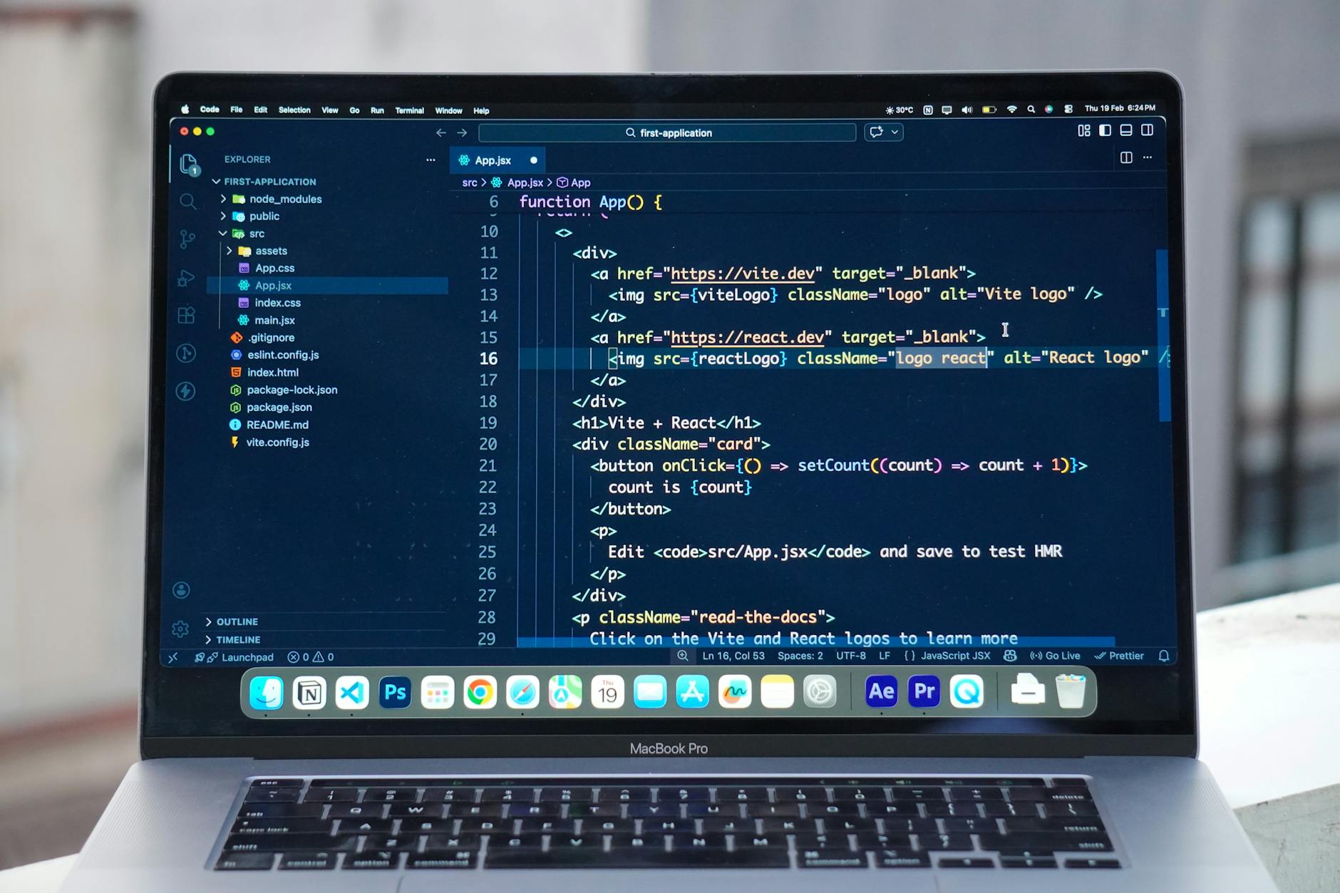 Developer coding React components on MacBook Pro, comparing modern frameworks versus WordPress for Australian small business 